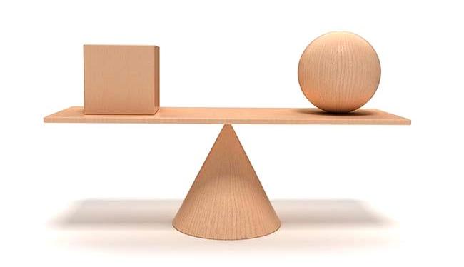 Block and wood ball on seesaw